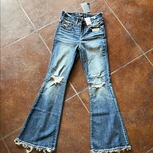 Buckle Distressed Blue Flare Jeans